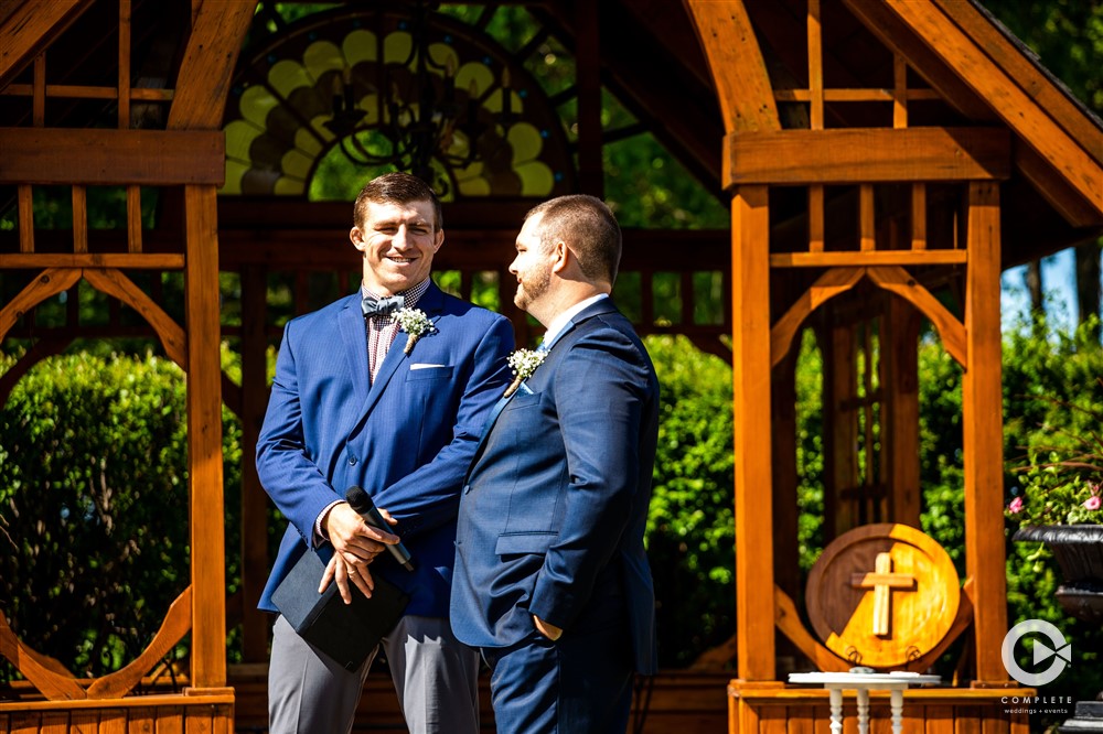 the groom eagerly awaits his bride